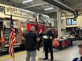 Fire Chief Keefe being sworn in by Board President Mashal.